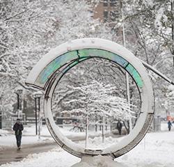 artwork on campus covered in snow