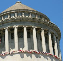 The dome of a building with American flag bunting