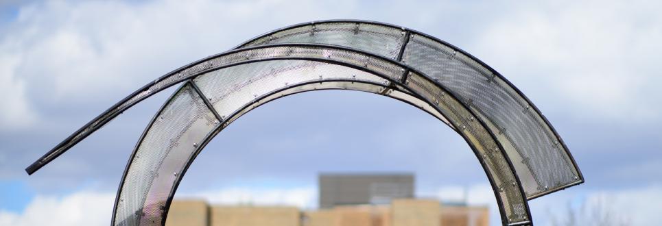 A closeup of a portion of a circular glass sculpture