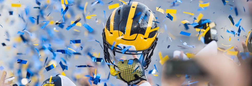 A football helmet surrounded by confetti